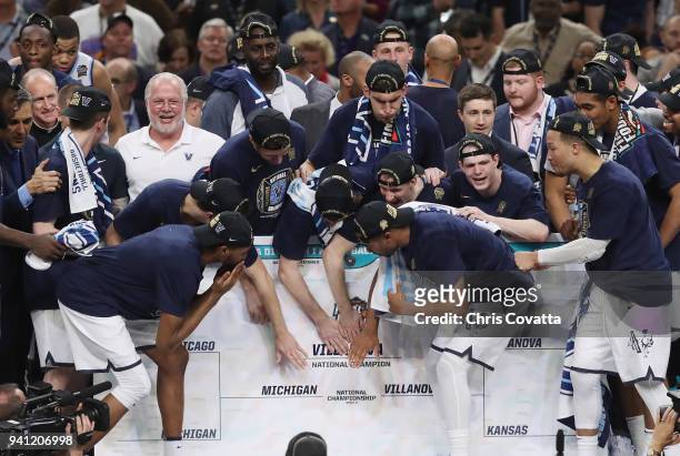 The Villanova Wildcats place their team's sticker on a bracket after defeating the Michigan Wolverines during the 2018 NCAA Men's Final Four National...