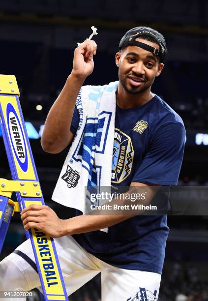 Mikal Bridges of the Villanova Wildcats holds a piece of the net after the 2018 NCAA Photos via Getty Images Men's Final Four National Championship...