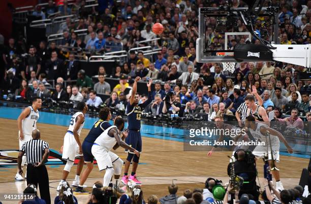 Muhammad-Ali Abdur-Rahkman of the Michigan Wolverines attempts a free throw against the Villanova Wildcats during the first half in the 2018 NCAA...