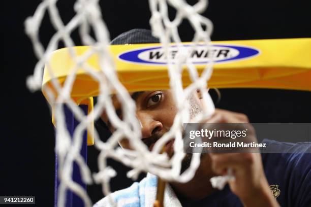 Phil Booth of the Villanova Wildcats cuts down the net after defeating the Michigan Wolverines during the 2018 NCAA Men's Final Four National...