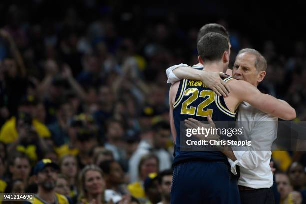 Head coach John Beilein and Duncan Robinson of the Michigan Wolverines hug after the 2018 NCAA Photos via Getty Images Men's Final Four National...