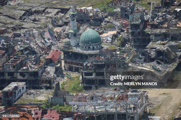 In this photo taken on March 28, 2018 shows an aerial shot of a destroyed mosque in Marawi City, in southern island of Mindanao, after five months of...