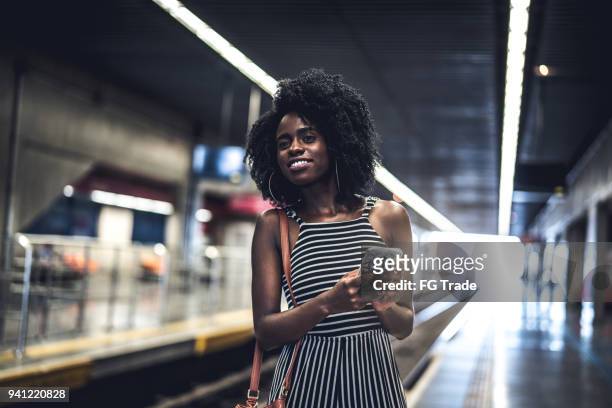 girl waiting the train at station - daily life in sao paulo stock pictures, royalty-free photos & images