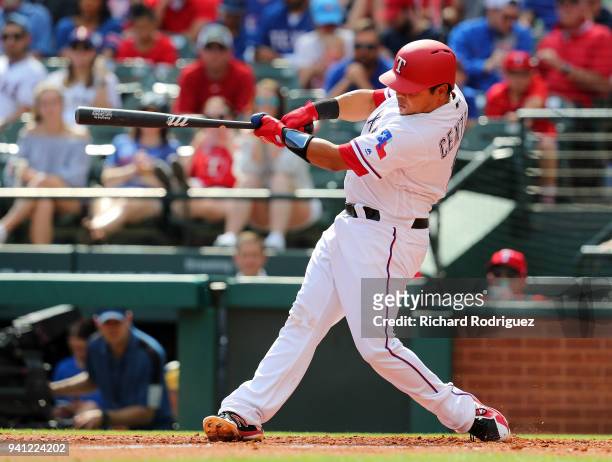 Juan Centeno of the Texas Rangers bats against the Houston Astros at Globe Life Park in Arlington on March 31, 2018 in Arlington, Texas.