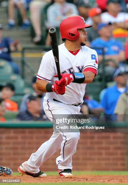 Juan Centeno of the Texas Rangers bats against the Houston Astros at Globe Life Park in Arlington on March 31, 2018 in Arlington, Texas.