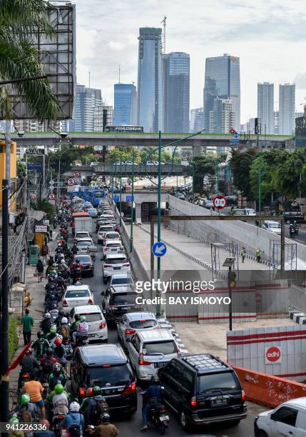 An under construction underpass is seen empty next to a traffic jams in Jakarta, on April 3, 2018.