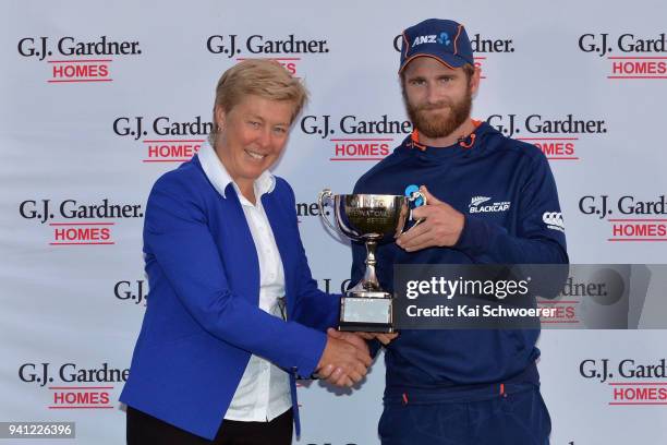 New Zealand Cricket President Debbie Hockley presents the series trophy to captain Kane Williamson of New Zealand during day five of the Second Test...