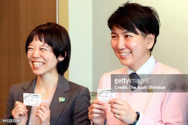 Miho Yamashita and her partner Anri Ishizaki pose for photographs at Fukuoka City Hall after receiving the partnership certificates on April 2, 2018...