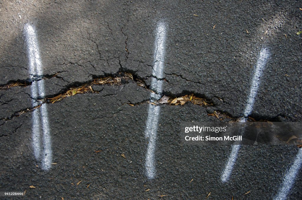 Footpath Bitumen White Spraypainted Lines Mark Uneven And Cracked Bitumen Footpath ...