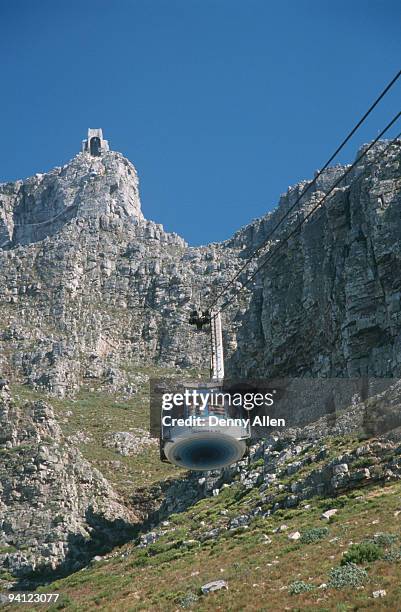 low-angle shot of table mountain cable-car, cape town, western cape province, south africa - cape town cable car stock pictures, royalty-free photos & images