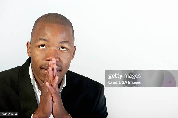 close up portrait of a young man looking up, hopefully, johannesburg, gauteng province, south africa - gauteng province fotografías e imágenes de stock