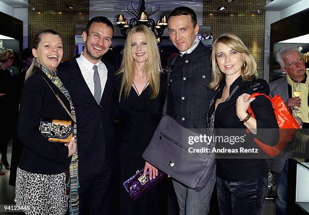Actress Anne-Sophie Briest, Eric Erhardt , actress Diana Amft, Hubertus Regout and actress Tina Ruland attend the pre-Christmas reception at MCM...