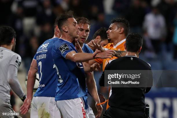 Porto's Brazilian forward Soares argues with Belenenses's midfielder Hassan Yebda of Algeria during the Portuguese League football match Belenenses...