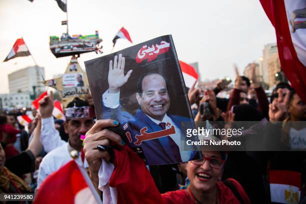 Supporters of Egyptian President Abdel Fattah al-Sisi celebrate at Tahrir square after the presidential election results were announced, in Cairo,...