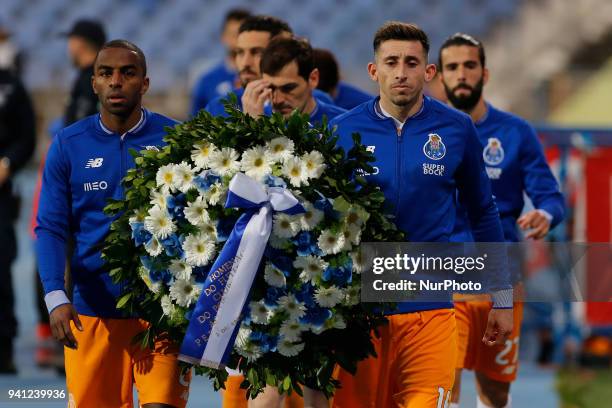 Porto Midfielder Hector Herrera from Mexico deliver a crown of flowers moments before the Portuguese League football match between CF Os Belenenses v...