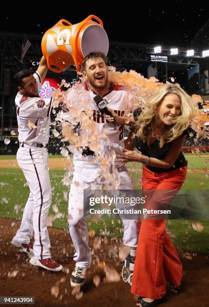 Jeff Mathis of the Arizona Diamondbacks and fox sports reporter Kate Longworth are dunked with gatorade by David Peralta after a walk-off RBI single...