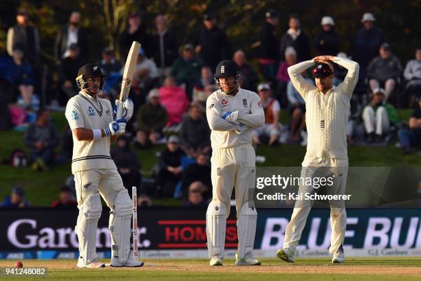 Neil Wagner of New Zealand looks on while Jonny Bairstow of England and Dawid Malan of England react during day five of the Second Test match between...