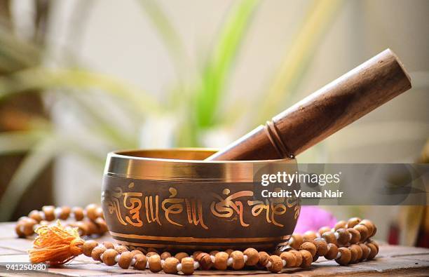 tibetan singing bowl with rosary beads/ahmedabad - gong stock pictures, royalty-free photos & images