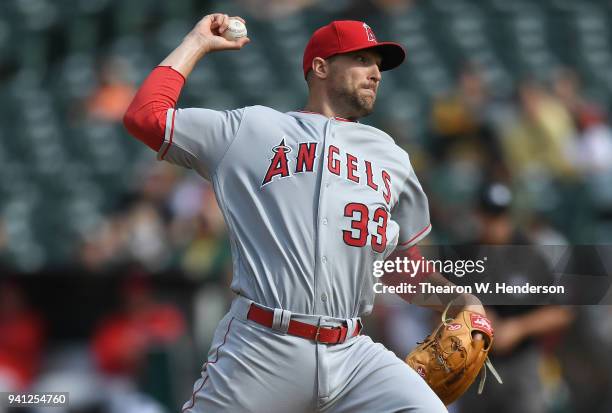 Jim Johnson of the Los Angeles Angels of Anaheim pitches against the Oakland Athletics in the bottom of the eighth inning at Oakland Alameda Coliseum...