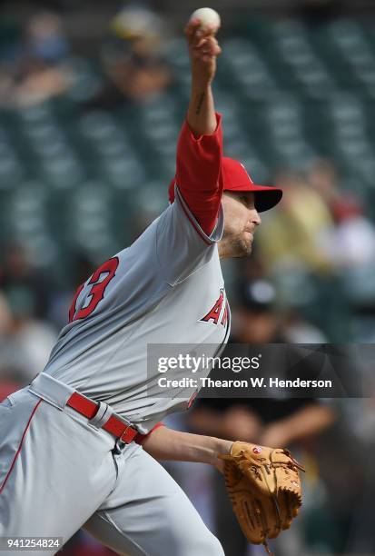 Jim Johnson of the Los Angeles Angels of Anaheim pitches against the Oakland Athletics in the bottom of the eighth inning at Oakland Alameda Coliseum...