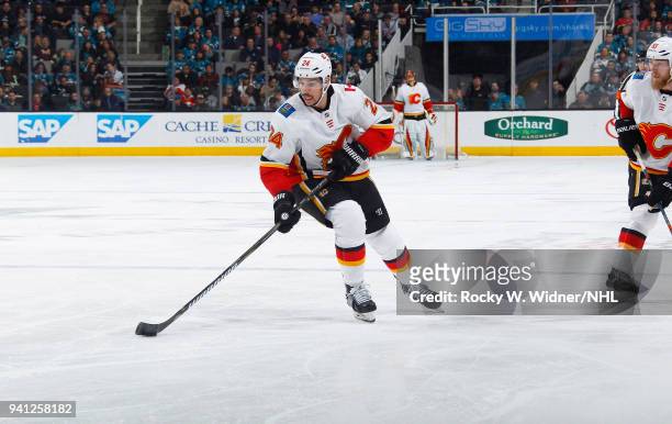 Travis Hamonic of the Calgary Flames skates with the puck against the San Jose Sharks at SAP Center on March 24, 2018 in San Jose, California. Travis...