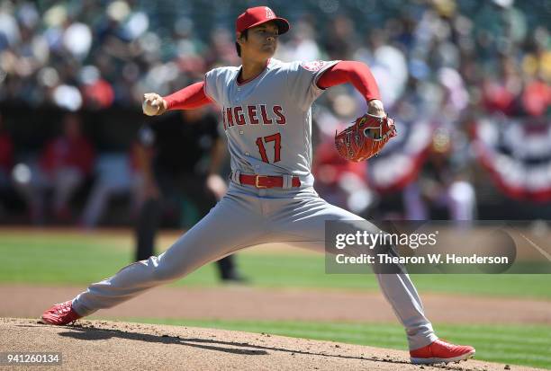 Shohei Ohtani of the Los Angeles Angels of Anaheim pitches in the bottom of the first inning of his Major League pitching debut against the Oakland...