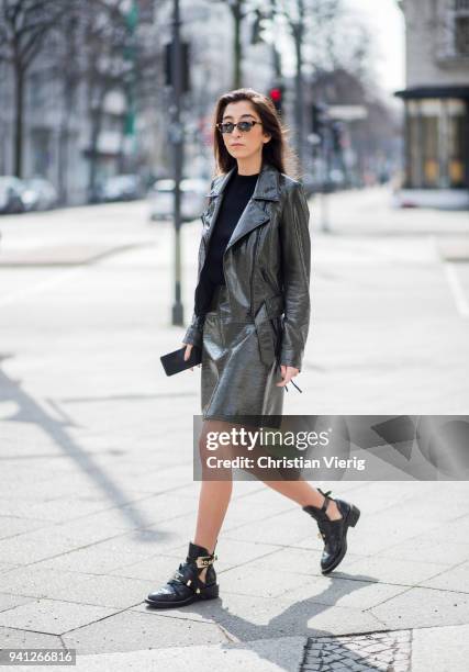 Nadja Ali wearing green skirt and jacket Lala Berlin, sunglasses Gigi Hadid for Vogue Eyewear, Balenciaga shoes is seen on March 30, 2018 in Berlin,...