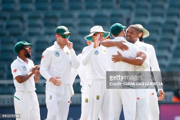 South African bowler Vernon Philander celebrates the dismissal of Australian batsman Pat Cummins on the fourth day of the fifth Test cricket match...