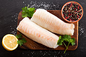fresh fish fillet with ingredients for cooking