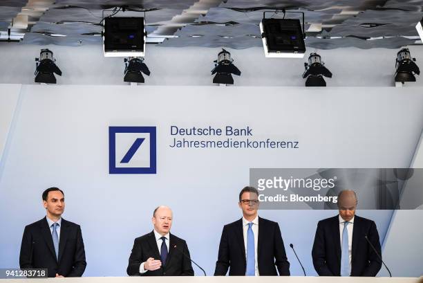 John Cryan, chief executive officer of Deutsche Bank AG, second left, speaks as he stands flanked by James von Moltke, chief financial officer of...