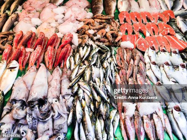 closeup of assorted seafood and fish at fish market in istanbul, turkey, selective focus. food background. raw fish and seafood. fresh food. - redfish stockfoto's en -beelden