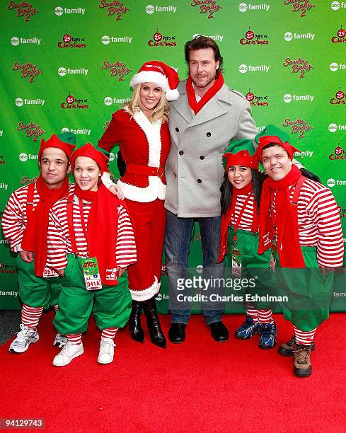 Actors Jenny McCarthy and Dean McDermott and elves attend the ABC Family's world record elf party at Bryant Park on December 7, 2009 in New York City.