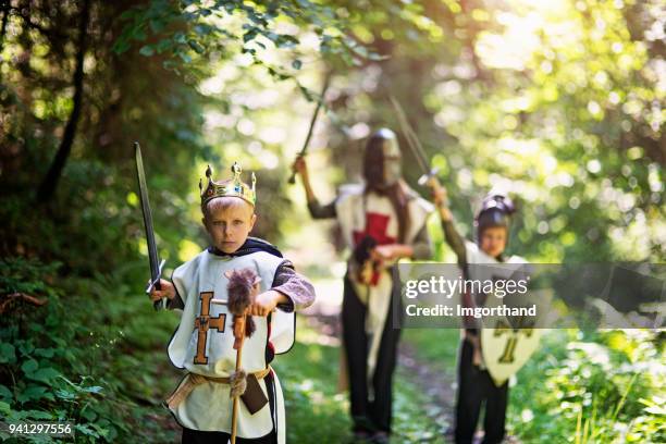 kids playing knights in forest - toy sword stock pictures, royalty-free photos & images