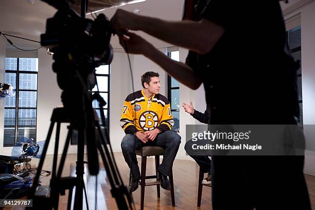Milan Lucic , left wing for the Boston Bruins, is interviewed by VH1's Jim Shearer at the Bryant Park Hotel on December 7, 2009 in New York City....