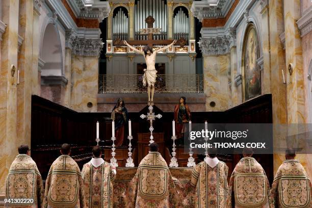 Franciscan friars dressed in liturgical ornaments offered by the French king Louis XV attend a mass at the Church of the Saint Saviour Convent, the...