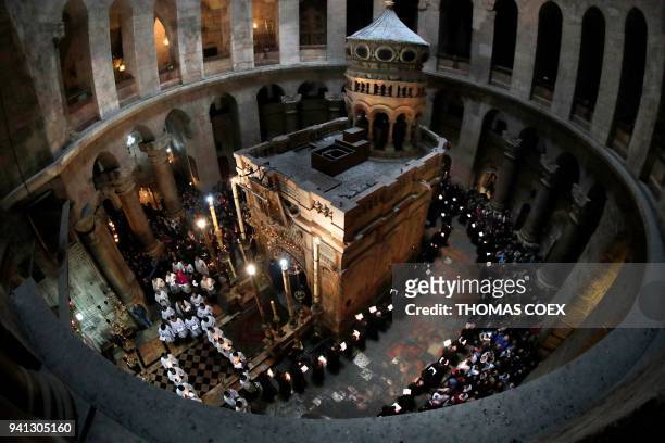 Franciscan friars pray and sing during the Lenten procession around the Tomb believed to the be site where Jesus Christ is buried in the Church of...