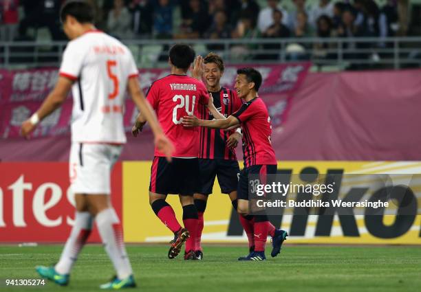 Yoichiro Kakitani of Cerezo Osaka celebrates scoring his side's second goal with his team mates Kazuya Yamamura and Atomu Tanaka during the AFC...