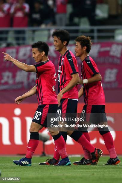 Yoichiro Kakitani of Cerezo Osaka celebrates scoring his side's second goal with his team mates Kazuya Yamamura and Atomu Tanaka during the AFC...