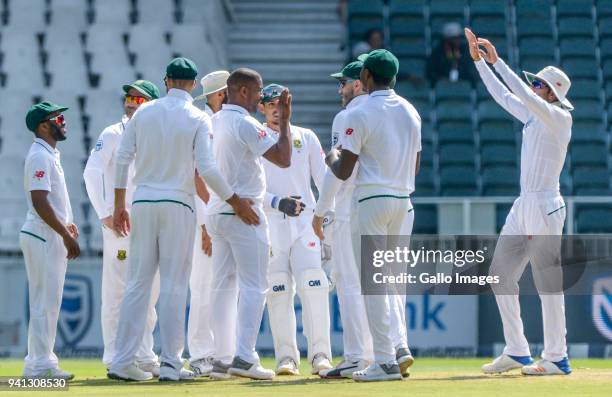 Vernon Philander of South Africa celebrates with teammates after taking a wicket during day 5 of the 4th Sunfoil Test match between South Africa and...