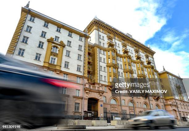 Cars drive past the building of the US embassy in Moscow on April 3, 2018. Russian Foreign Minister Sergei Lavrov suggested that the poisoning of...