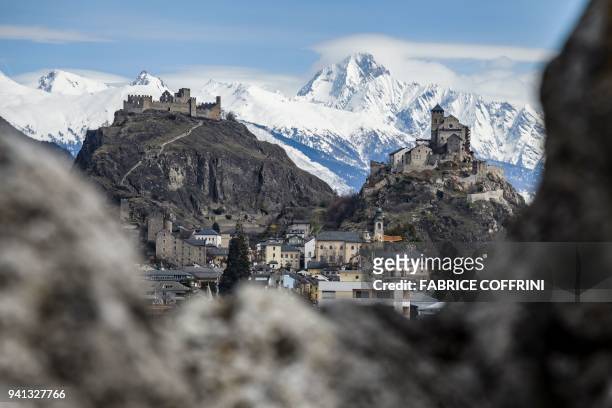 Picture taken on April 2, 2018 in Sion, western Switzerland, shows Tourbillon Castle and Valere Basilica fortified church , overlooking the city. -...