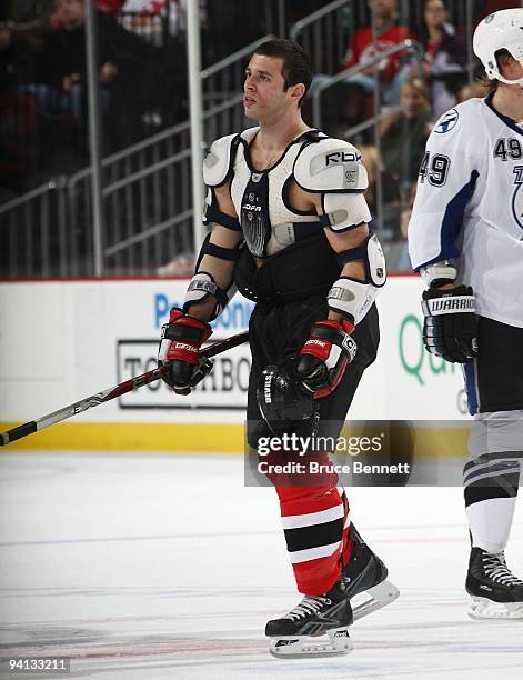 Matthew Corrente of the New Jersey Devils skates returns to the bench after a fight aginst the Tampa Bay Lightning at the Prudential Center on...