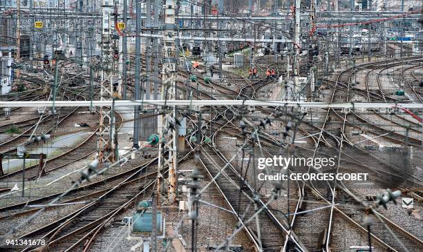 Rail tracks are seen at the Saint Jean train station in Bordeaux on April 3 at the start of three months of rolling rail strikes. - Staff at state...