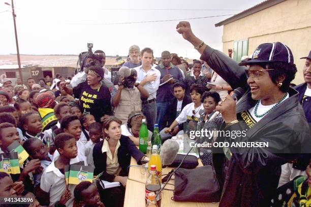 Anti-apartheid campaigner Winnie Madikizela-Mandela of the African National Congress shouts "Amandla" to greet the crowd, 21 April in the...