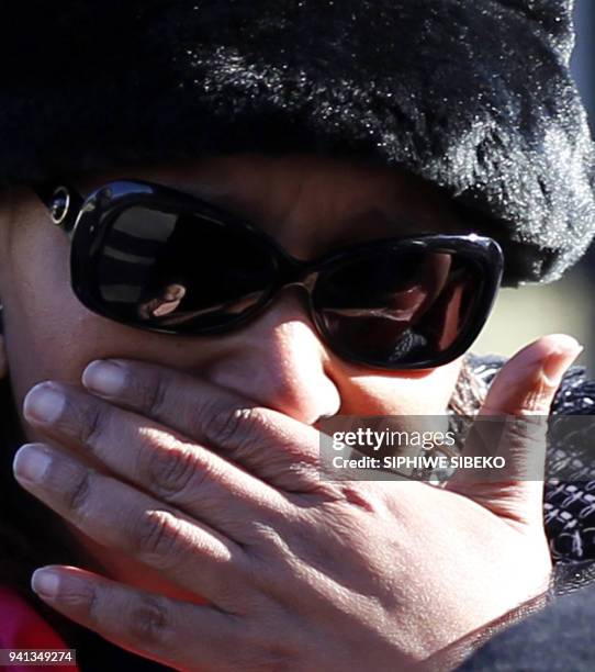 Zenani Mandela, daughter of Nelson Mandela and Winnie Madikizela-Mandela, reacts during the memorial service of her relative Zenani Mandela at the St...