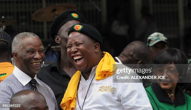South Africa's former president Thabo Mbeki and ANC's Youth Leader Julius Malema smile as former wife of South African icon Nelson Mandela,...