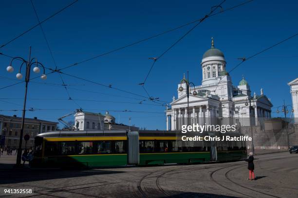 Tram drives past Helsinki Cathedral on March 30, 2018 in Helsinki, Finland.