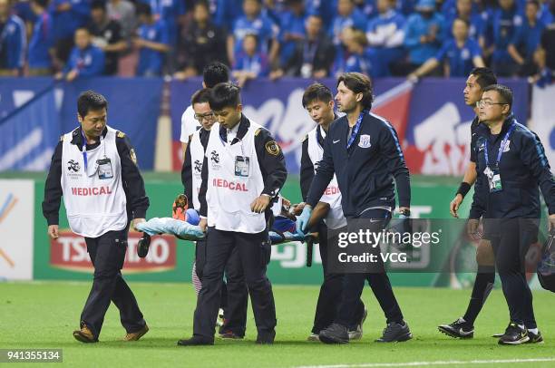 Obafemi Martins of Shanghai Shenhua is carried off on a stretcher during AFC Champions League Group H match between Shanghai Shenhua and Kashima...