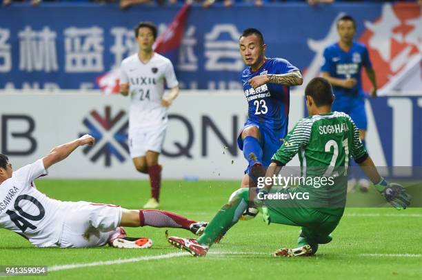 Bai Jiajun of Shanghai Shenhua shoots the ball during AFC Champions League Group H match between Shanghai Shenhua and Kashima Antlers at the Hongkou...