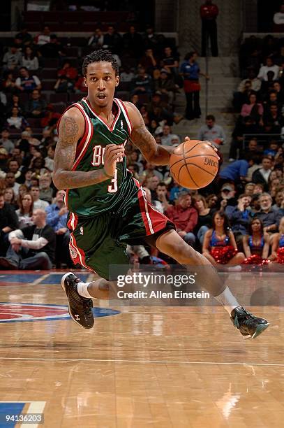 Brandon Jennings of the Milwaukee Bucks drives against the Detroit Pistons during the game on December 4, 2009 at The Palace of Auburn Hills in...